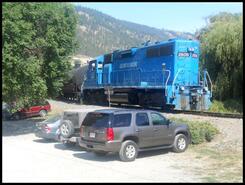Kelowna Pacific Railway train about to cross over Oyama Road on its way south