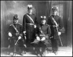 Group of four unidentified men in uniform from Quayle family
