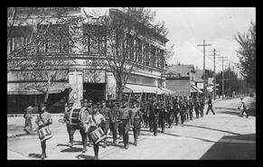 Rocky Mountain Rangers on route march in front of Hudson's Bay Company store