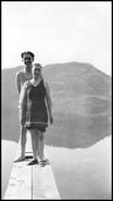 Young man and woman dressed in their bathing suits ready for a day of swimming