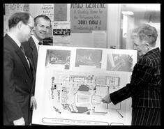 Bob Bissell, Wayne McGrath, and Marie Fleming with plans for Performing Arts Centre