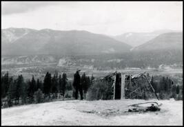 Man next to branch and bow shelter at Fairmont Hot Springs looking west