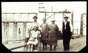 Members of the Miner family in front of Pine Street bridge under construction