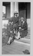 Three unidentified young ladies on steps of Adair home