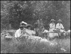 Group enjoying a picnic in the woods
