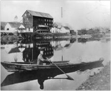 Jack Bailey in bateaux delivering flour across the river