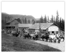 Wagons in front of hotel and trading post, Rock Creek
