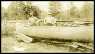 Job Maley with unidentified man and boat