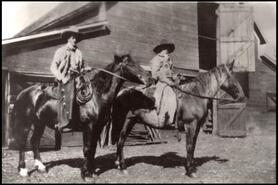 Cowboys Frank Archer and unidentified on horseback at Guichon ranch