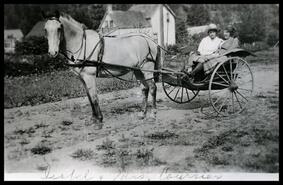 Isabel Coursier and mother in carriage on Front Street