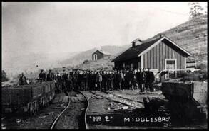 Miners standing on tracks outside No. 2 South Mine at Middlesboro