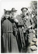 H.W. McInnes in military uniform with his parents