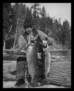 Man with two large fish caught in Okanagan Lake