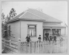 Unidentified group on house porch