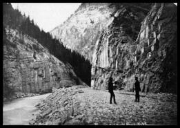 Two men on the Kicking Horse Canyon C.P.R. railroad bed