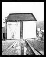 Railway tracks going into building at Sicamous Sawmill