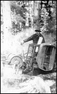 Carl Chantler operating a donkey engine in the bush