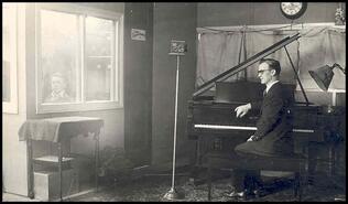 Tommy Evans at the piano in radio station 10AT [later CJA], early 1930s
