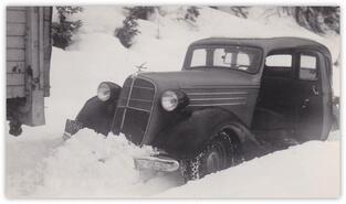 Car stuck in snow, ca. 1935