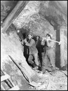 Three miners working in a mine, Lumby