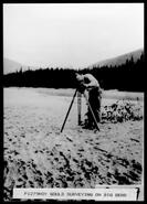 Roy Gould surveying for Big Bend Highway