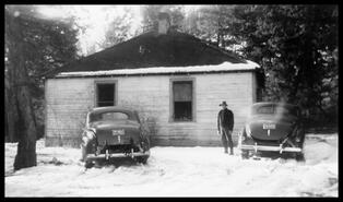 Man outside cabin at Fintry