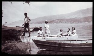 Group in rowboat at school picnic at Petries
