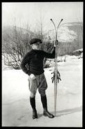 Nels Nelsen standing with skis