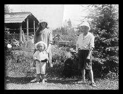 Gwen and Charles Horace Murray (Bubbles) Strongitharm and a family friend at Strongitharm farm in the BX area