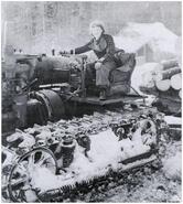 Unidentified woman on a Holt engine logging cat