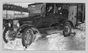 Mr. Townsend in his car in snow