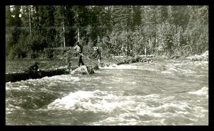 River view with survey crew members, unknown location