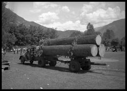Truck carrying logs at 60th anniversary of Golden Spike Days and Dominion Day parade