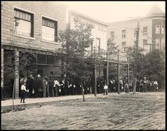 Men lined up outside the Bank of Montreal on C.M. & S. Co. Ltd pay day