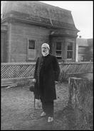 Reverend J.H. Lambert in front of the C.E. Mohr house