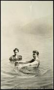 Two women swimming in Christina Lake