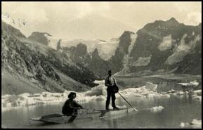Walter Nixon and unidentified man in boat on Lake of the Hanging Glaciers