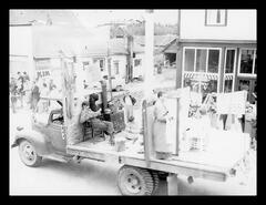 Old homestead float in parade