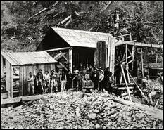 Gold mining workers at Aurora Wheel at Williams Creek