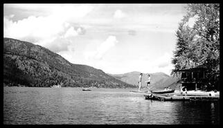 Postcard of two people standing on a diving board, Christina Lake, B.C.
