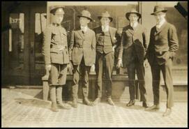 [Group of men with a soldier in uniform]