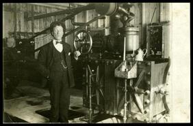 Man in engine room of B.L. Company, Comaplix, B.C.