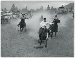 Allan Tegart and John Wesley Bowers horse racing at the Columbia Valley Stampede