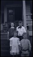 Children on the steps of the O'Keefe Mansion