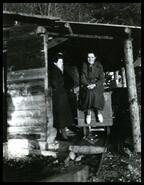 Gladys Reynolds and unidentified woman with an ore car at the Ottawa Mine