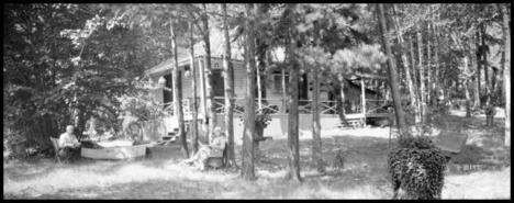 Couple sitting in the Hunter family summer home yard