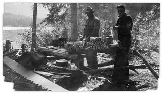 Men taking a meal break from logging
