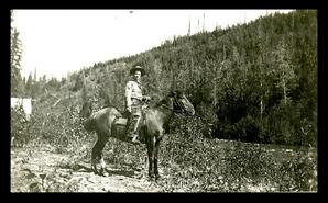 Survey crew member and horse, unknown location