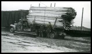 Group posing with truck loaded with lumber from Sawyer's Mill on Campbell Avenue