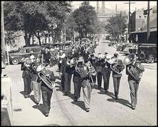 Band marching down Bay Avenue